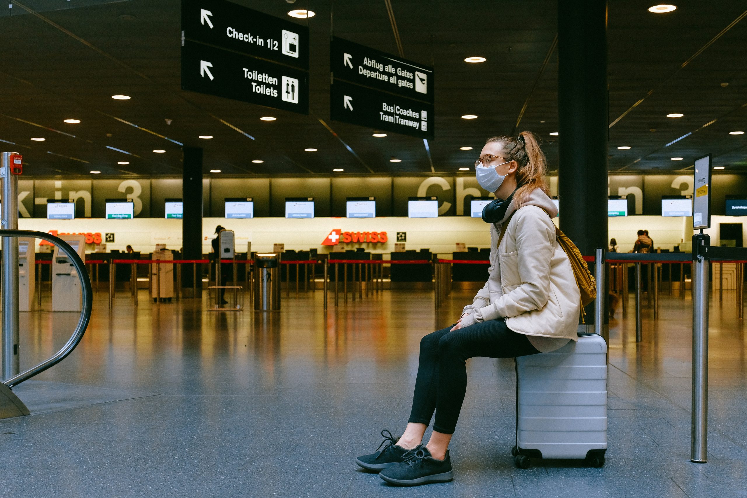 woman-on-luggage-facemask